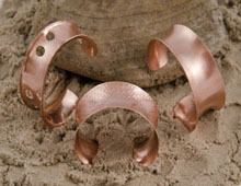 Copper, roller embossed, anticlastic formed